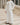 Al Ain Kandura – Men's Off-White Tassel Emirati Thobe, walking toward camera – Thobe Wala
