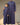 Father and son standing together in matching navy blue Saudi thobes with geometric contrast trim along the collar, shoulders, and placket.