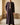 Little Ajman Kandura – Boys' Plum Tassel Emirati Thobe, walking toward camera, thobe wala signature · warm plaster interior – Thobe Wala