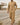 Mina Thobe – Men's Tan Band Collar Saudi Thobe, walking toward camera – Thobe Wala