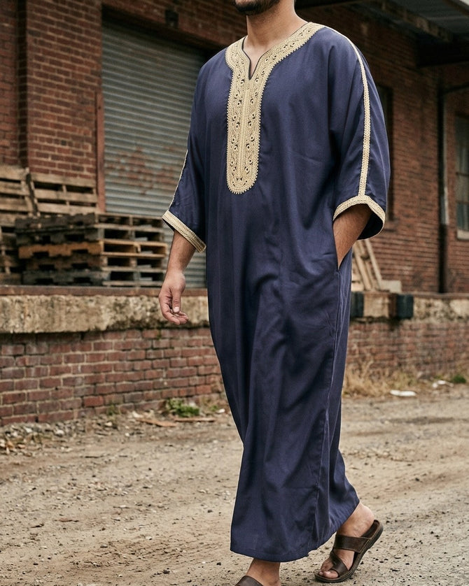 Tangier Gandora – Men's Navy Gold Embroidered Moroccan Thobe, walking toward camera – Thobe Wala
