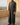 Little Baha Thobe – Boys' Black Trimmed Saudi Thobe, walking toward camera, rl heritage · wood-panelled library – Thobe Wala